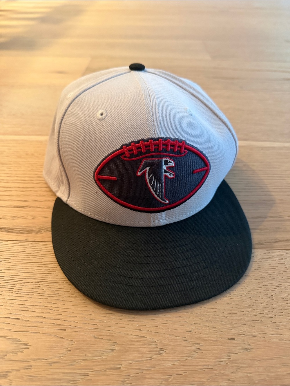 New Era White and Black Snapback Hat with Red Atlanta Falcons Emblem